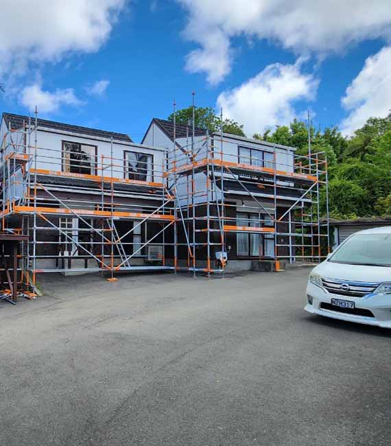 house painters working on Wellington home exterior